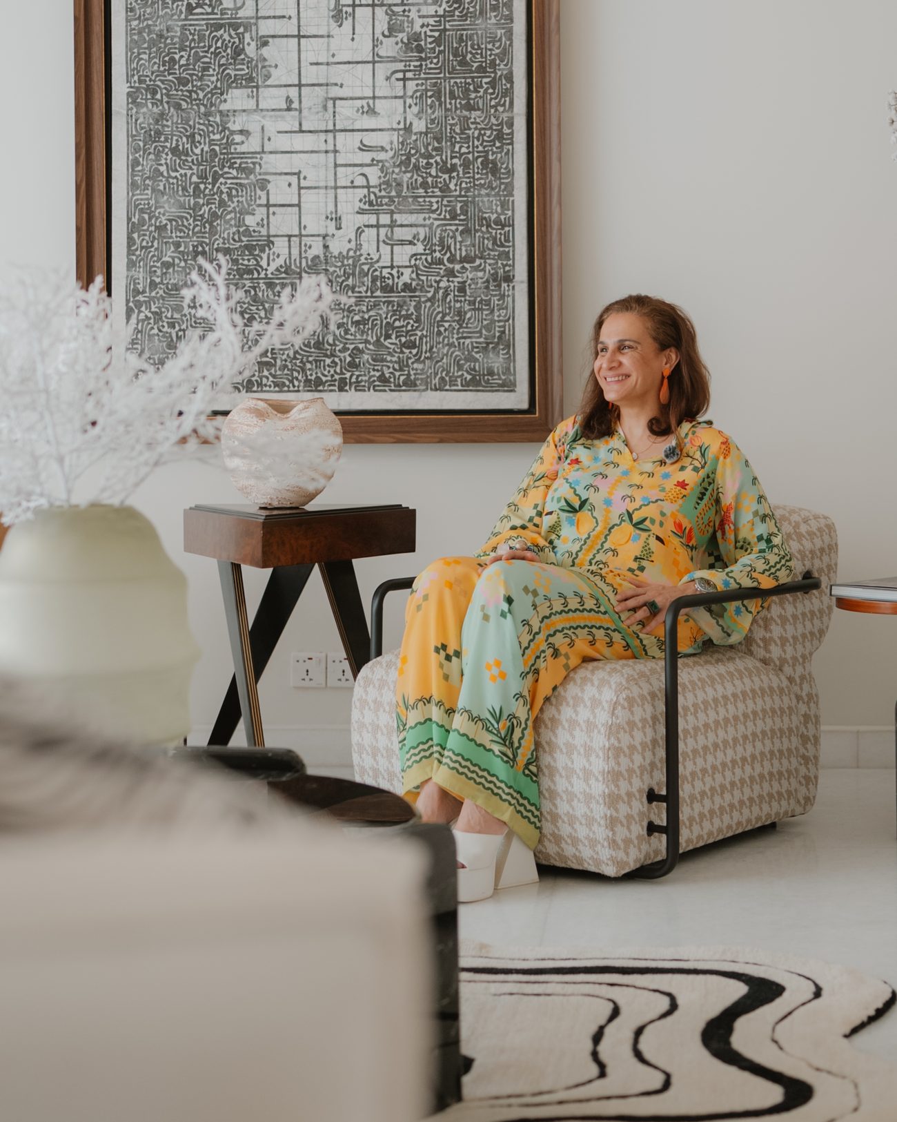 Mahnaz Fareed, founder of Maison M, seated in a lounge she designed