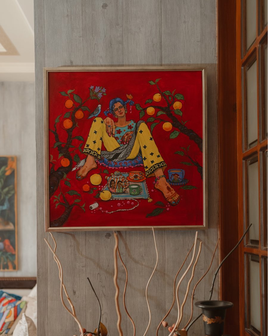 A red painting of a seated figure among fruit